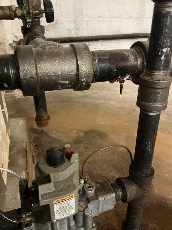 Completed preventative maintenance on 20-year-old boiler system, including inspection of gas valve assembly, pressure relief valve mechanisms, piping connections, and expansion tank. Air handler maintenance was deferred due to ambient temperature conditions preventing proper AC system evaluation. Customer expressed interest in smart thermostat upgrade for future consideration.