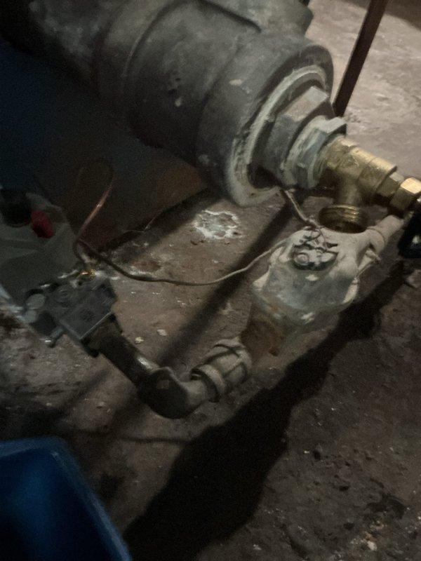 Performed comprehensive annual maintenance on 30-year-old steam boiler system. Inspected pump assembly, motor housing, and associated piping connections for wear and operational integrity. Conducted combustion analysis using digital flue gas analyzer, recording temperature readings of 381.5°F and oxygen levels of 3.8%, confirming proper combustion efficiency within acceptable parameters. Verified all threaded connections, assessed pump condition showing age-appropriate wear, and confirmed system operational status.
