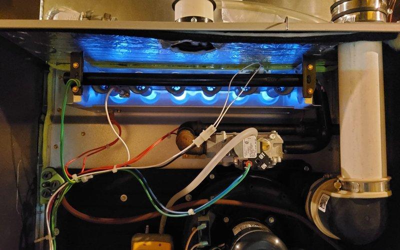 Completed comprehensive tune-up and safety inspection on two gas furnace systems. Verified proper ignition sequence, burner operation with clean blue flame pattern, electrical connections, and control functionality on both units. Customer informed of home protection plan renewal availability for continued coverage.
