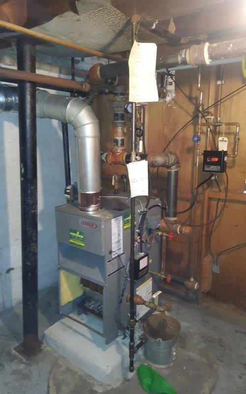 Responded to no-heat call on 15-year-old Lennox furnace system located in basement. Upon arrival, confirmed unit was not operating following recent service visit. Performed diagnostic inspection and discovered burner assembly had failed to ignite. Removed access panel and inspected burner compartment, noting blue LED flame sensor indicators were illuminated but burners were not firing. Checked gas supply line pressure and confirmed adequate flow to manifold. Tested ignition system components and verified proper voltage to igniter. Identified issue with burner ignition sequence and reset control board parameters. Cycled system through multiple heating calls to confirm proper ignition and flame establishment across all burner ports. Verified blower motor operation and air distribution through supply ductwork. Inspected copper refrigerant lines and gas piping connections for any signs of leaks or damage. Confirmed all safety controls functioning properly including flame sensor and limit s