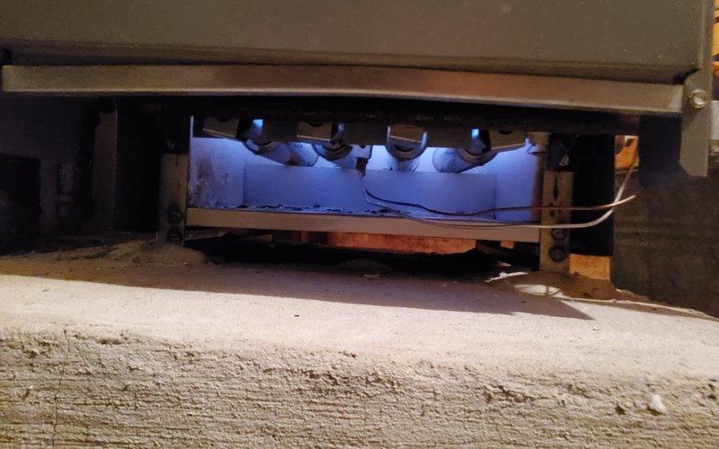 Responded to no-heat call on 15-year-old Lennox furnace system located in basement. Upon arrival, confirmed unit was not operating following recent service visit. Performed diagnostic inspection and discovered burner assembly had failed to ignite. Removed access panel and inspected burner compartment, noting blue LED flame sensor indicators were illuminated but burners were not firing. Checked gas supply line pressure and confirmed adequate flow to manifold. Tested ignition system components and verified proper voltage to igniter. Identified issue with burner ignition sequence and reset control board parameters. Cycled system through multiple heating calls to confirm proper ignition and flame establishment across all burner ports. Verified blower motor operation and air distribution through supply ductwork. Inspected copper refrigerant lines and gas piping connections for any signs of leaks or damage. Confirmed all safety controls functioning properly including flame sensor and limit s