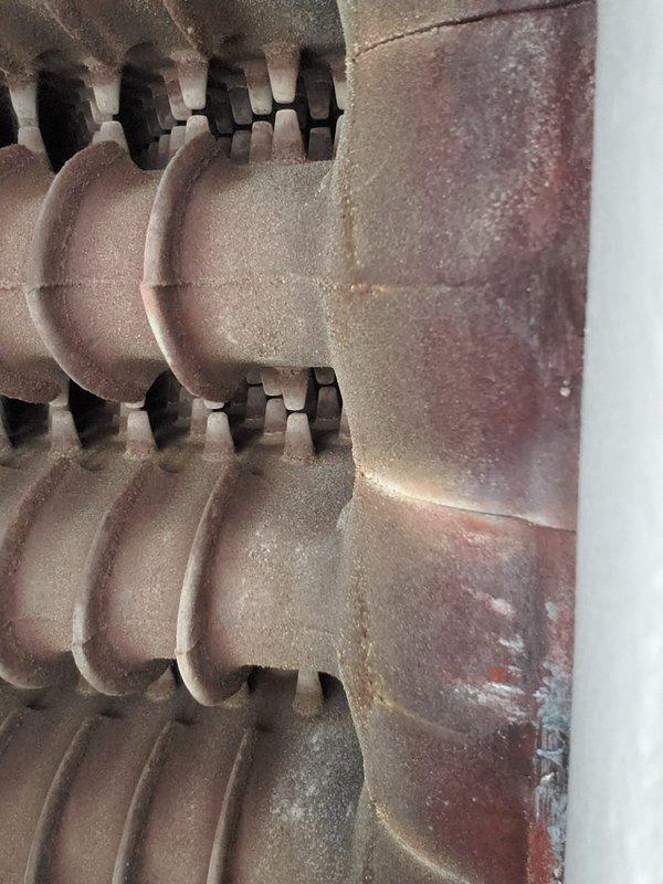 Completed preventive maintenance on gas-fired boiler system. Inspected burner assembly and confirmed proper ignition with all burners firing with clean blue flames. Verified heat exchanger condition and checked all system components for safe operation.