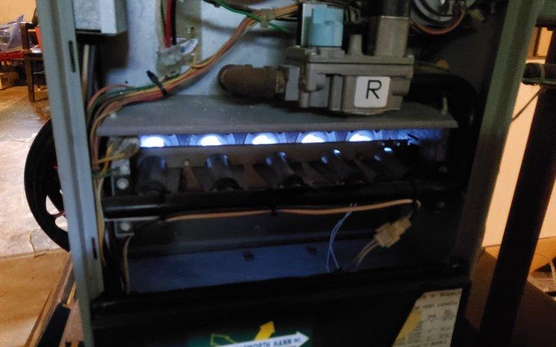 Responded to no-heat call on 20-year-old Trane furnace with complete system failure and no power indication. Upon inspection, diagnosed failed thermal fuse preventing all system operation. Replaced defective thermal fuse with OEM-equivalent component and restored power to unit. Verified proper ignition sequence, confirmed burner assembly firing correctly with proper blue flame characteristics across all ports, and tested full heating cycle operation. System returned to normal function with all safety controls operating within specifications.