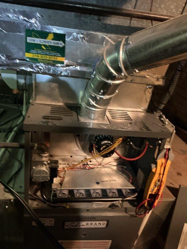 Completed annual heating system inspection and maintenance on two residential furnace units per service contract agreement. Responded to customer concern regarding water presence in mechanical area and performed thorough assessment to verify system integrity and proper operation.

Conducted comprehensive tune-up and safety inspection on both furnace systems. Performed combustion analysis using digital measuring equipment, recording temperature differential readings and verifying proper heat exchanger operation. Measurements indicated acceptable operating parameters with supply temperatures and temperature rise within manufacturer specifications.

Inspected all accessible components including heat exchangers, burner assemblies, ignition systems, and flame sensors. Verified proper venting and condensate drainage systems on both units. Examined PVC condensate lines for leaks, blockages, or signs of water accumulation that may have prompted initial service call. Confirmed drain lines were 