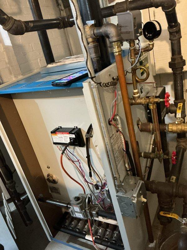 Performed preventative maintenance tune-up on 8-year-old residential boiler system located in basement. Conducted comprehensive inspection of boiler components, burner assembly, ignition control module, gas connections, and associated piping including copper supply lines and shut-off valves with pressure gauges. Verified proper operation of all safety controls, tested system functionality, and confirmed equipment is operating within manufacturer specifications.