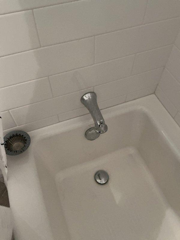 Responded to service call for multiple plumbing issues including two blocked sinks, leaking toilet, toilet replacement request, and shower inspection. Assessed and addressed drainage concerns at kitchen and bathroom sink locations. Evaluated TOTO toilet for reported leak and discussed replacement options with property occupant. Inspected bathtub plumbing fixtures including chrome spout, drain assembly, and strainer for proper operation and potential issues. Documented conditions of toilet and tub installations with photographs for service records.