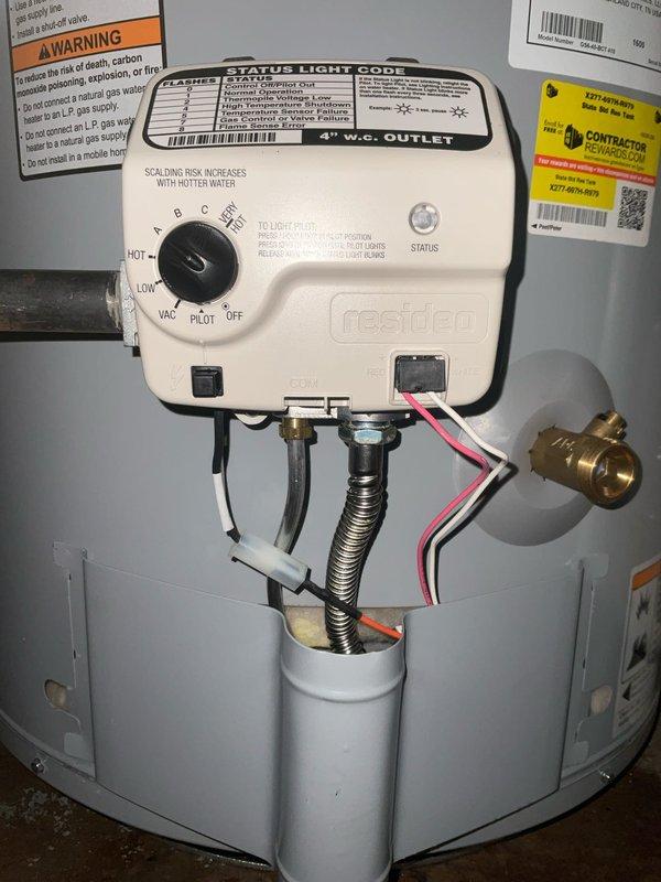 Completed warranty replacement of residential water heater in basement utility area. Removed existing failed unit and installed new white cylindrical water heater with proper connections including copper supply lines, expansion tank at base, and venting system. Configured control assembly with temperature settings and verified all plumbing connections, gas line hookup via flexible corrugated tubing, and proper clearances around unit. Service was scheduled after completion of separate boiler preventive maintenance to avoid conflicts between technicians working in same space.