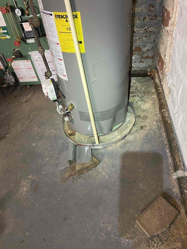 Responded to service call back regarding water heater sensor malfunctions occurring since recent boiler installation. Upon inspection, found Weil-McLain boiler and water heater installed in close proximity in basement mechanical room. Investigated potential interference between newly installed heating system and existing water heater controls. Examined piping configuration, electrical connections, and equipment placement to identify source of recurring sensor shutoffs. Documented installation layout with photographs showing equipment positioning, piping runs, and overall mechanical room conditions. Verified proper clearances and checked for potential heat transfer or vibration issues affecting water heater sensor operation.
