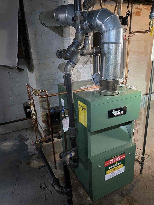 Responded to service call back regarding water heater sensor malfunctions occurring since recent boiler installation. Upon inspection, found Weil-McLain boiler and water heater installed in close proximity in basement mechanical room. Investigated potential interference between newly installed heating system and existing water heater controls. Examined piping configuration, electrical connections, and equipment placement to identify source of recurring sensor shutoffs. Documented installation layout with photographs showing equipment positioning, piping runs, and overall mechanical room conditions. Verified proper clearances and checked for potential heat transfer or vibration issues affecting water heater sensor operation.
