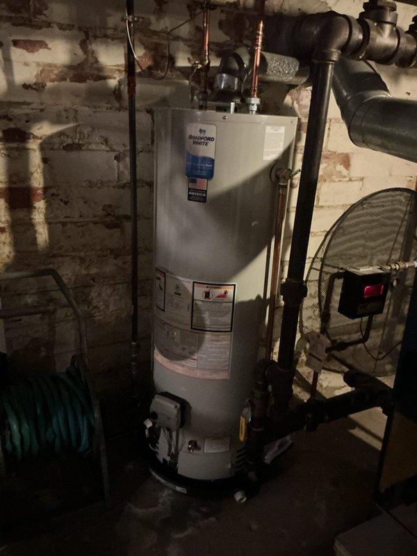 Completed tune-up service on two boiler systems in basement mechanical room: one electric unit and one steam boiler, both approximately 12 years old. Replaced defective coupling on steam piping system to ensure proper connection integrity. Performed standard maintenance procedures on both units, inspecting water heater connections, pressure relief valves, and associated copper piping to verify safe operating conditions.