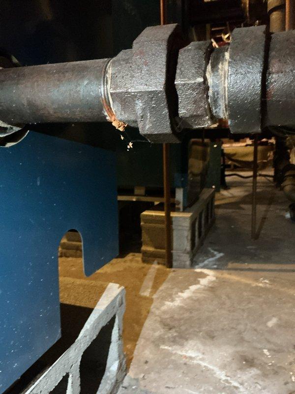 Completed tune-up service on two boiler systems in basement mechanical room: one electric unit and one steam boiler, both approximately 12 years old. Replaced defective coupling on steam piping system to ensure proper connection integrity. Performed standard maintenance procedures on both units, inspecting water heater connections, pressure relief valves, and associated copper piping to verify safe operating conditions.