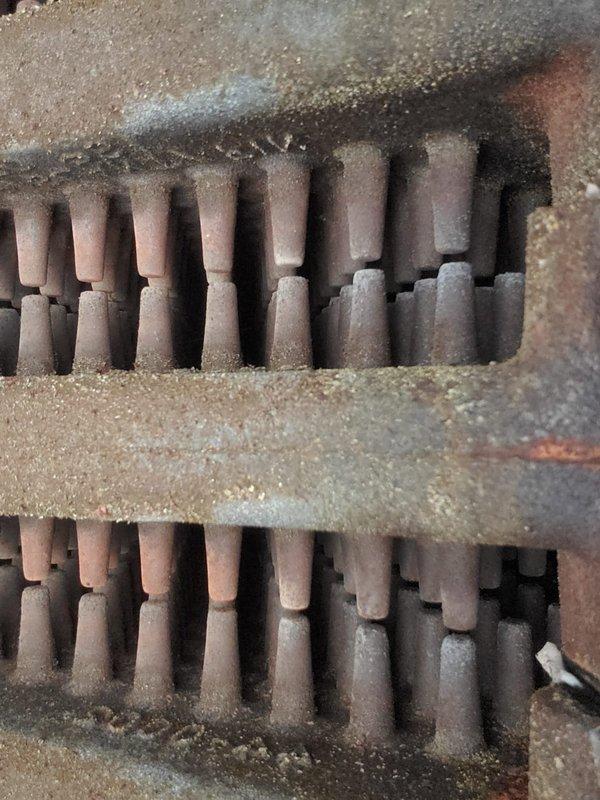 Responded to service call for inadequate heat distribution to second floor. Upon inspection of 10-year-old boiler unit in basement, found heat exchanger tubes and internal components heavily coated with dust, sediment buildup, and surface oxidation. Noted significant corrosion on metal panels and heat exchange assembly, which was impeding efficient heat transfer. Performed thorough cleaning of heat exchanger tubes and burner assembly, removed accumulated debris from all accessible surfaces, and verified proper operation of circulator pump and zone valves. Tested system operation and confirmed improved heat output and distribution throughout home.