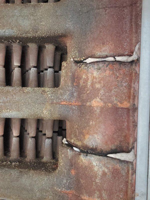 Responded to service call for inadequate heat distribution to second floor. Upon inspection of 10-year-old boiler unit in basement, found heat exchanger tubes and internal components heavily coated with dust, sediment buildup, and surface oxidation. Noted significant corrosion on metal panels and heat exchange assembly, which was impeding efficient heat transfer. Performed thorough cleaning of heat exchanger tubes and burner assembly, removed accumulated debris from all accessible surfaces, and verified proper operation of circulator pump and zone valves. Tested system operation and confirmed improved heat output and distribution throughout home.