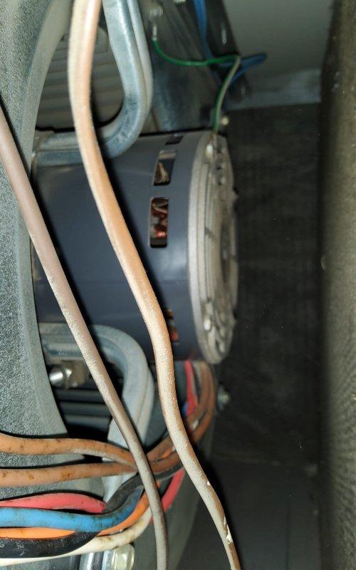 Performed comprehensive tune-up and maintenance on 25+ year old furnace system in residential basement installation. Conducted thorough inspection of blower motor assembly, ductwork connections, and all mechanical components. Evaluated thermostat operation and temperature accuracy concerns reported by homeowner, checking calibration and system cycling. Inspected burner assembly, heat exchanger, gas connections, and electrical wiring for safety and proper operation. Cleaned blower compartment, checked belt tension and motor bearings, and verified proper airflow through extensive metallic ductwork system. Tested all safety controls and limit switches to ensure proper function. Given the advanced age of the unit, documented current operating condition and recommended monitoring for potential future replacement considerations.