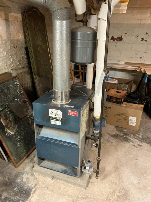 Responded to service call for 16-year-old boiler system operating at insufficient pressure (5-6 PSI instead of required 12+ PSI). Performed comprehensive system inspection and tuneup, checking all components for proper operation. Inspected expansion tank, pressure relief valve, and associated piping connections. Verified all safety controls, burner operation, and heat exchanger condition. Adjusted system pressure to manufacturer specifications and confirmed proper pressurization. Tested all mechanical components including circulator pump, zone valves, and control systems to ensure optimal performance and safe operation.