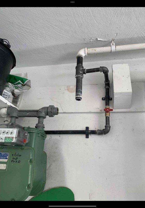 Completed pressure testing and final installation of gas line previously run to garage heater. Initial installation had been performed, but heater manufacturer required pressure testing before commissioning. Gas utility company attempted repair but determined scope exceeded their capabilities. Verified all connections, performed pressure test on gas piping system to manufacturer specifications, confirmed system integrity and proper operation of gas meter and supply lines. All piping secured and tested to code requirements for safe heater operation.