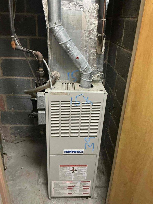 Responded to service call for residential furnace not turning on following recent thermostat installation. Upon arrival, inspected 28-year-old Tempstar furnace unit located in basement utility area. Evaluated system operation, electrical connections, thermostat wiring, and overall equipment condition. Documented existing furnace installation with galvanized ductwork, gas line connections, and associated mechanical components. Based on age of equipment and operational assessment, provided estimate for complete HVAC system replacement to address heating failure and prevent future reliability issues.