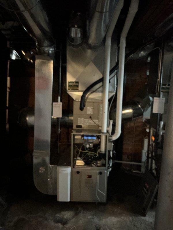 Completed comprehensive heating maintenance on residential forced-air furnace system during scheduled 12-4 service window. Performed standard MVP heating maintenance protocol including inspection of furnace cabinet, internal components, and digital control panel. Verified proper operation of all mechanical systems, examined ductwork connections and plenum assembly, and confirmed adequate airflow throughout the distribution system. Inspected PVC condensate drain lines, electrical connections at junction boxes, and flexible ductwork sections for proper installation and condition. All components found operating within normal parameters with no immediate service needs identified.