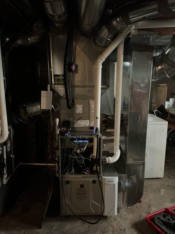 Completed comprehensive heating maintenance on residential forced-air furnace system during scheduled 12-4 service window. Performed standard MVP heating maintenance protocol including inspection of furnace cabinet, internal components, and digital control panel. Verified proper operation of all mechanical systems, examined ductwork connections and plenum assembly, and confirmed adequate airflow throughout the distribution system. Inspected PVC condensate drain lines, electrical connections at junction boxes, and flexible ductwork sections for proper installation and condition. All components found operating within normal parameters with no immediate service needs identified.