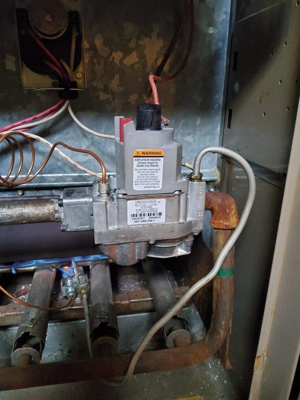 Responded to no heat call on gas furnace. Upon arrival, confirmed thermostat calling for heat but unit not responding. Standing pilot was lit but main burners would not ignite. Performed diagnostic testing on gas valve and control board circuit. Found faulty gas valve not opening on call for heat despite proper 24V signal from control board. Tested voltage at valve terminals and confirmed power supply but valve actuator failed to operate. Replaced defective gas valve assembly and reconnected all wiring and gas piping. Restored gas supply, performed leak test on connections, and cycled unit through multiple heating cycles. Main burners ignited properly with strong blue flames across all ports. Verified proper flame sensor operation and burner sequencing. Monitored unit through complete heating cycle to ensure reliable ignition and normal operation. System restored to full functionality with proper heat output.