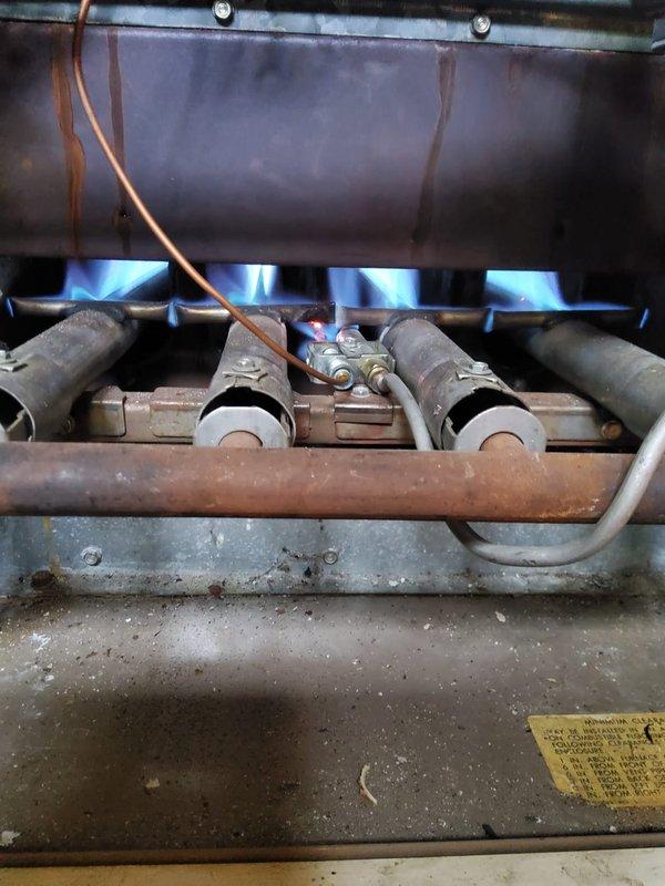 Responded to no heat call on gas furnace. Upon arrival, confirmed thermostat calling for heat but unit not responding. Standing pilot was lit but main burners would not ignite. Performed diagnostic testing on gas valve and control board circuit. Found faulty gas valve not opening on call for heat despite proper 24V signal from control board. Tested voltage at valve terminals and confirmed power supply but valve actuator failed to operate. Replaced defective gas valve assembly and reconnected all wiring and gas piping. Restored gas supply, performed leak test on connections, and cycled unit through multiple heating cycles. Main burners ignited properly with strong blue flames across all ports. Verified proper flame sensor operation and burner sequencing. Monitored unit through complete heating cycle to ensure reliable ignition and normal operation. System restored to full functionality with proper heat output.