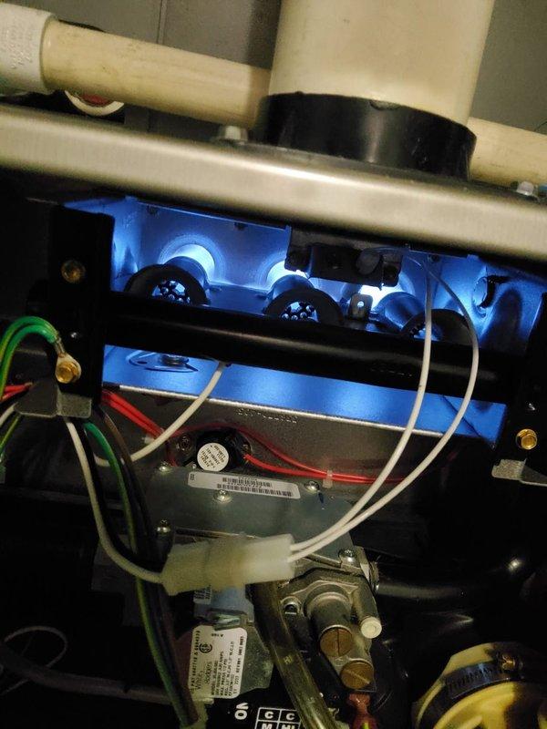 Performed annual maintenance on a 4-year-old gas furnace, inspecting the burner assembly, wiring connections, gas valve, and venting, and confirming stable blue flame characteristics across the burners. Conducted combustion analysis, recording 12.5% O₂ and 31 ppm CO, and verified the furnace is operating safely within normal parameters.