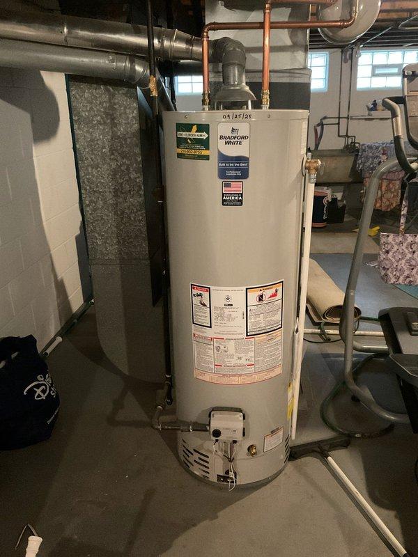 Responded to a no-heat call on a gas-fired storage water heater with a pilot that would not stay lit. Inspected the unit, gas control valve, and burner compartment, and verified the supply piping and flue connections were intact with no signs of leaks or rust. Checked system water pressure at the utility sink gauge to confirm the water supply was within normal operating range.