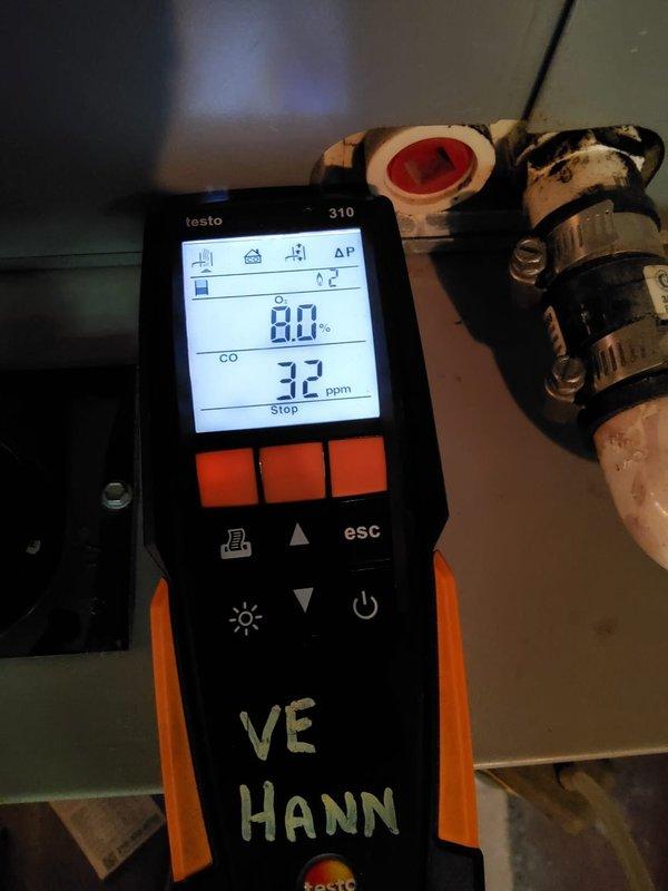 Performed annual maintenance on the gas furnace, inspecting the burner compartment, igniter and flame sensor wiring, gas valve, and PVC vent connections, with no visible rust, frost, or damage found. Verified a stable blue burner flame and conducted a combustion analysis, recording 8.0% O2 and 32 ppm CO, which is within acceptable limits. Noted dark residue staining on the flue piping and couplings, and the system is operating normally at completion.