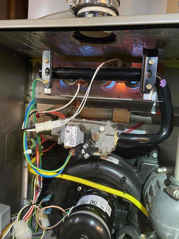 Replaced the failed inducer motor and pressure switch on the gas furnace. Verified proper draft inducer operation, pressure switch response, and burner ignition, with a stable blue flame and normal sequence of operation observed upon completion.