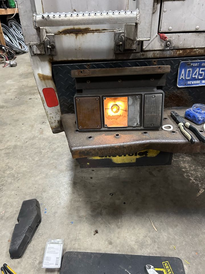 Steven and I repairing brake light with new socket and bulb. 