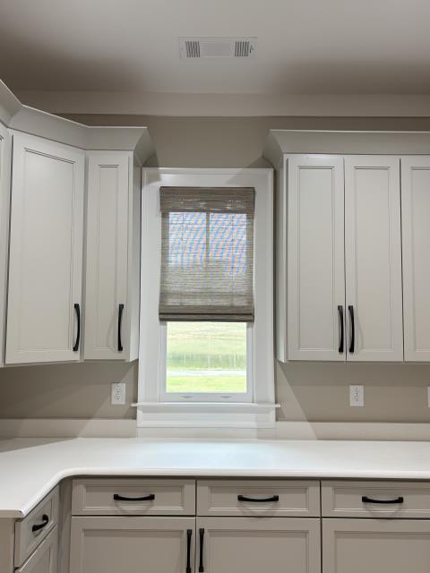Custom Cordless Woven Wood Roman Shades project completed in Palmetto, GA. 