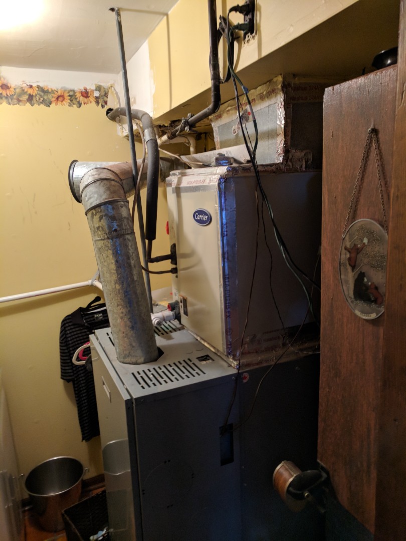 Replacing old oil heating system with new high-efficiency carrier gas heating system