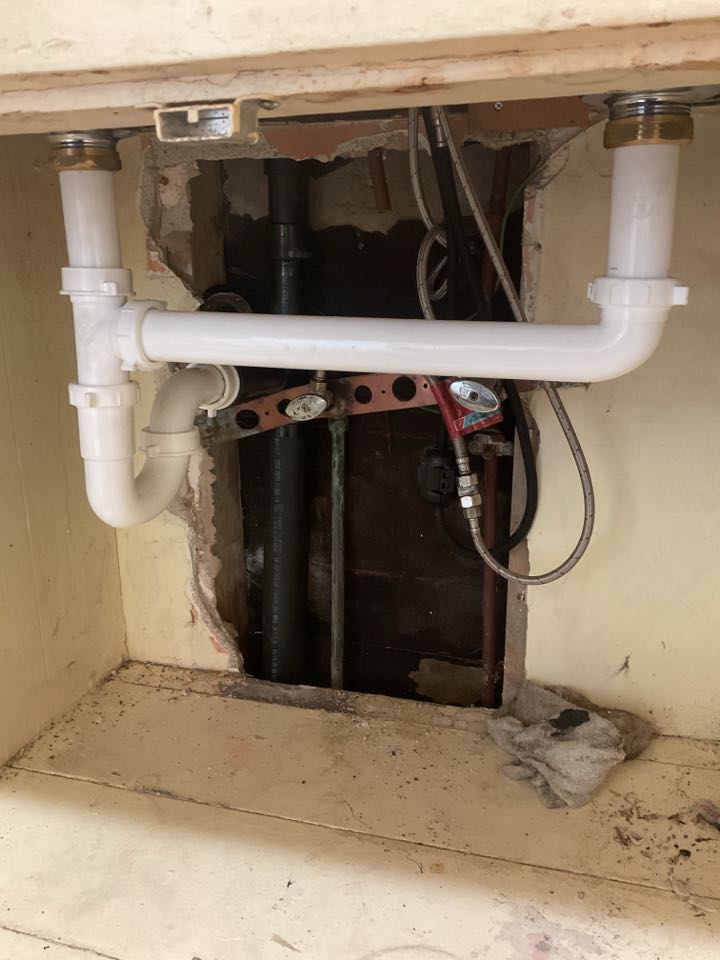 Install new drain line for kitchen sink 