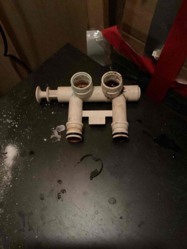 Diagnosed water softener with leaking bypass valve that had developed a crack at the connection point. Removed damaged bypass valve and installed new replacement unit. System tested after repair with successful results and no further leakage observed.