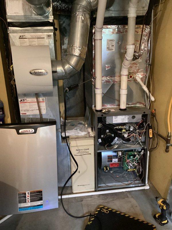 Performed scheduled maintenance tune-up on Lennox HVAC system with integrated Aprilaire accessory. Inspected all components including ductwork connections, PVC drainage/ventilation pipes, and electrical connections at furnace. Unit was operational upon arrival with no issues noted; all systems verified functioning within proper parameters.