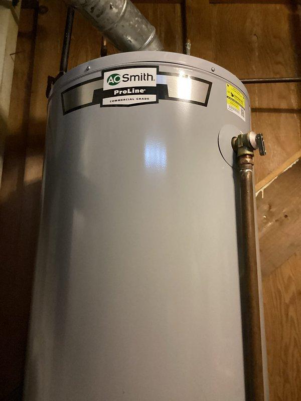Responded to service call for water heater not working. Upon inspection, determined A.O. Smith ProLine commercial grade water heater is functioning properly. Issue was identified as furnace malfunction affecting hot air distribution through vents. Advised customer to schedule HVAC service for furnace evaluation.
