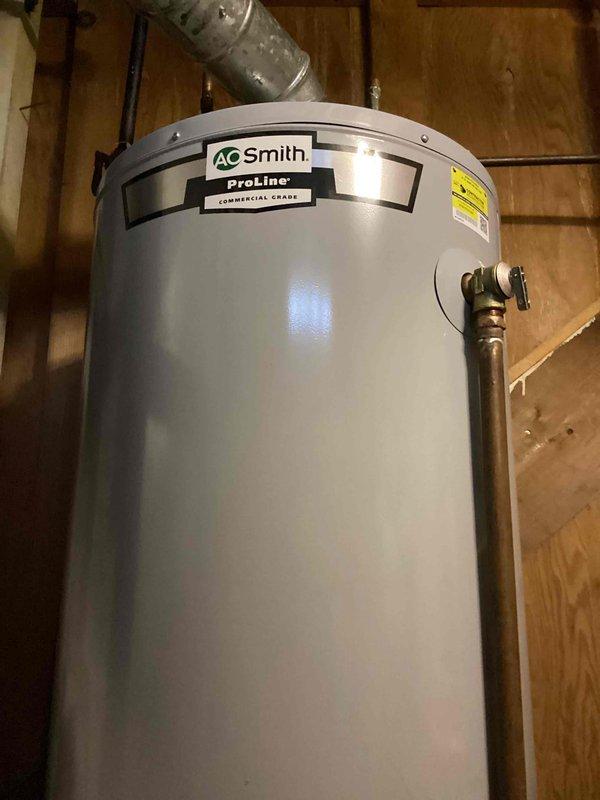Responded to service call for water heater not working. Upon inspection, determined A.O. Smith ProLine commercial grade water heater is functioning properly. Issue was identified as furnace malfunction affecting hot air distribution through vents. Advised customer to schedule HVAC service for furnace evaluation.