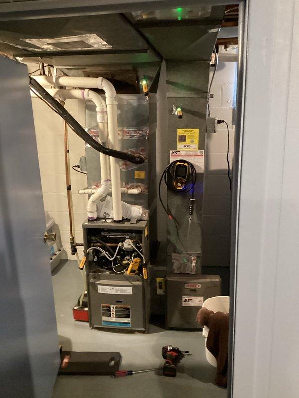 Performed scheduled preventive maintenance agreement service on residential furnace system. Conducted full inspection of furnace unit, associated ductwork, and condensate drainage components. All systems functioning properly with green indicator light confirming operational status.
