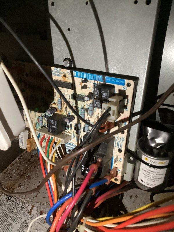 Diagnosed a no-heat issue on an aging furnace system. Inspection revealed the furnace was circulating cool air due to a failed control board, as evidenced by examination of the circuit board components. Recommended replacement options for both the control board and complete system based on unit age exceeding 10 years.