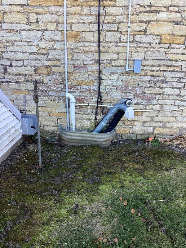 Performed scheduled preventive maintenance agreement service on residential furnace. Inspection revealed significant corrosion and rust buildup on heat exchanger components and burner assembly. Exterior condensate drainage system was also examined, with particular attention to the foundation drainage configuration.