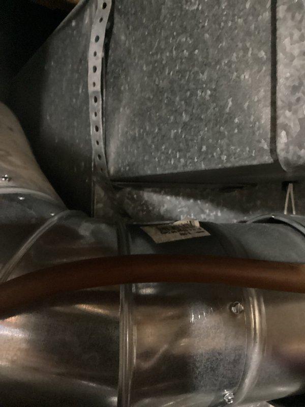 Responded to service call regarding damper issue. Upon inspection, found damper motor binding on venting due to damper switch that had detached. Identified installation-related issue with motor mechanism requiring repair. Documented condition of ductwork, connections and supporting hardware with photographs for follow-up work.