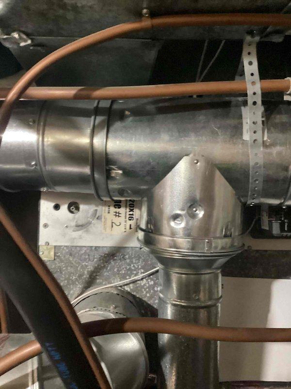 Responded to service call regarding damper issue. Upon inspection, found damper motor binding on venting due to damper switch that had detached. Identified installation-related issue with motor mechanism requiring repair. Documented condition of ductwork, connections and supporting hardware with photographs for follow-up work.