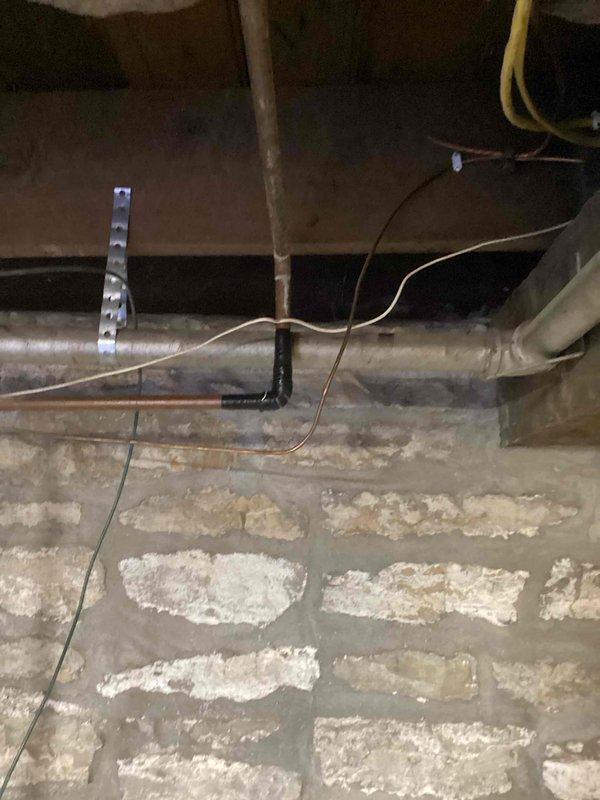 Responded to service call for a pin hole leak on 1/2" copper mainline in basement. Located leak on water main directly after meter. Cut out damaged copper section and replaced with new piping. Additionally installed new 1/3" ball valve on the mainline immediately after the meter for improved system control.