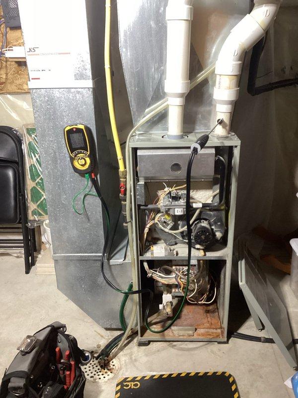 Performed standard tune-up on air handler unit. Conducted combustion analysis with readings of 24F supply, 46F return, CO2 at 6.2%, system loss at 11.5%, and excess air at 90.4%. Inspected furnace interior components including wiring, motor, and electrical connections; all components functioning normally with no issues identified.