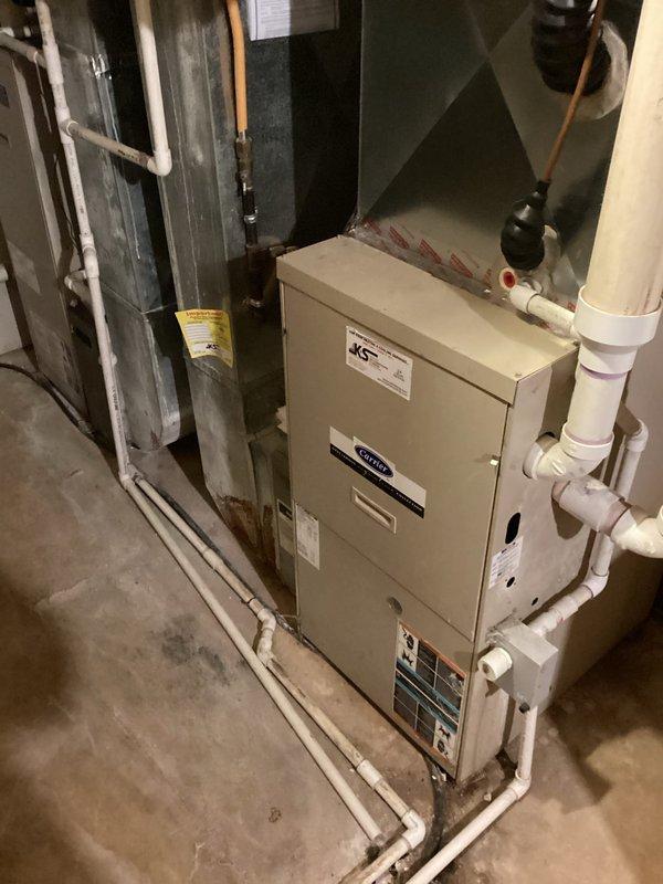 Performed scheduled tune-up on Bryant furnace system with primary focus on air handler maintenance. Responded to issue with one thermostat that had gone blank; diagnosed and restored functionality. System inspection revealed proper installation of PVC ventilation/drainage components and verified all connection points were secure. Both Carrier and Bryant units were examined and confirmed to be operating within normal parameters.