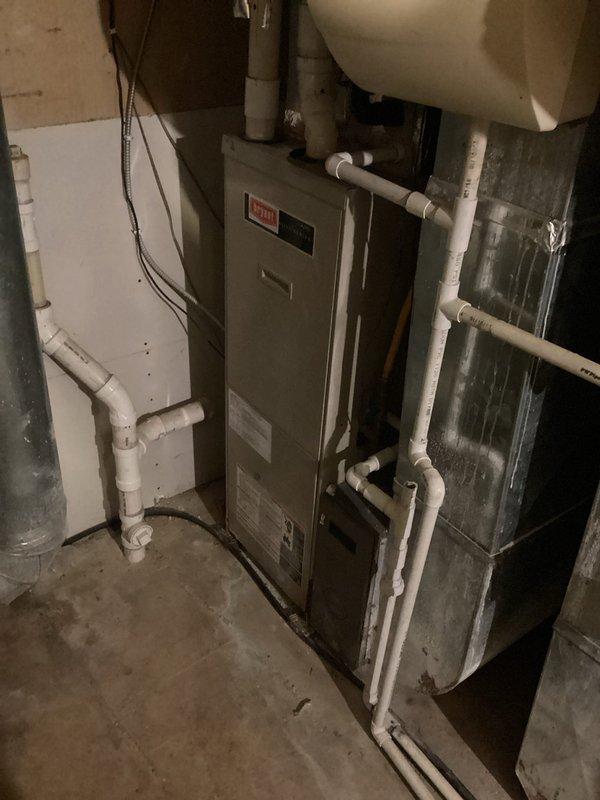 Performed scheduled tune-up on Bryant furnace system with primary focus on air handler maintenance. Responded to issue with one thermostat that had gone blank; diagnosed and restored functionality. System inspection revealed proper installation of PVC ventilation/drainage components and verified all connection points were secure. Both Carrier and Bryant units were examined and confirmed to be operating within normal parameters.