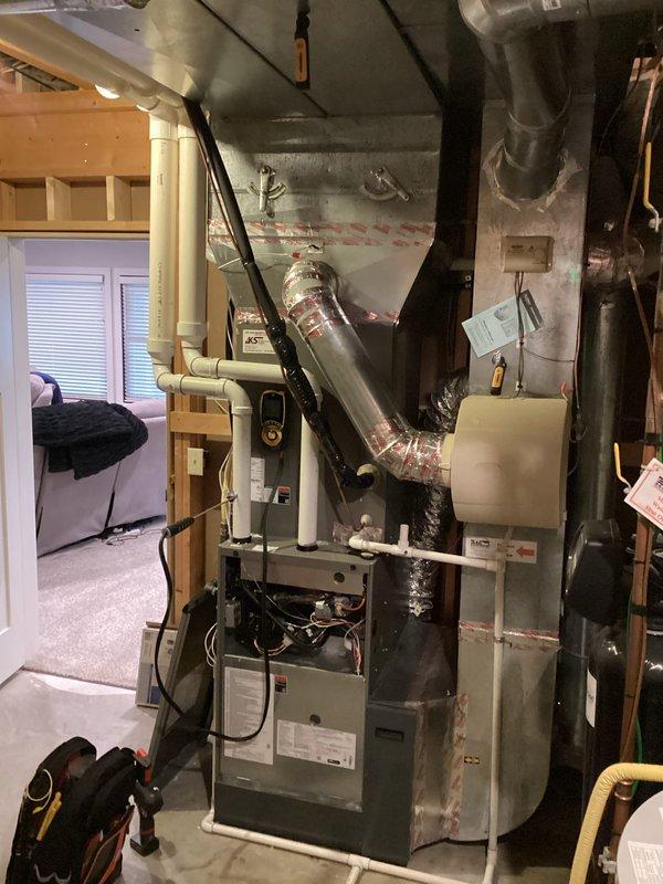 Performed scheduled preventative maintenance agreement service on residential furnace system during 8-12 arrival window as arranged with customer. Completed comprehensive inspection and maintenance of Lennox heating system, including filter replacement. Also examined the outdoor AC condenser unit which was properly mounted on concrete block wall with adequate drainage setup.
