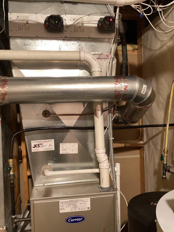 Successfully installed an Aprilaire Model 600 humidifier on a Carrier HVAC system per customer-approved bid. Mounted the digital control panel with humidistat displaying 36% humidity level and connected all necessary wiring to the furnace system. Unit was tested for proper function before completion.