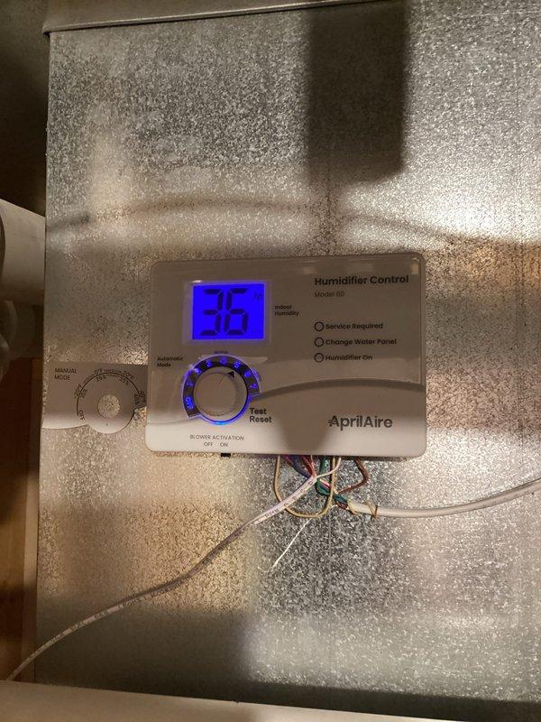 Successfully installed an Aprilaire Model 600 humidifier on a Carrier HVAC system per customer-approved bid. Mounted the digital control panel with humidistat displaying 36% humidity level and connected all necessary wiring to the furnace system. Unit was tested for proper function before completion.