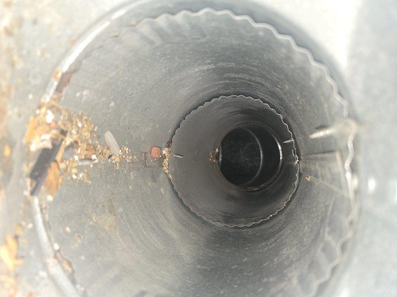 Performed comprehensive duct cleaning service during scheduled 7:30-8am arrival window. Removed significant dust and debris accumulations from the HVAC ductwork system, particularly focusing on corrugated metal ducts showing brownish-orange deposits at joints. Thoroughly cleaned all vents to improve system airflow and indoor air quality.